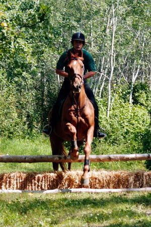 Ben_riding_Sloan_cross_country.jpg - Ben riding Sloan on TP cross country course