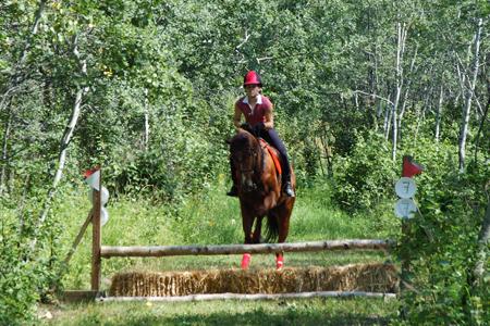 Brooke_riding_Solo_cross_country_1.jpg - Brooke riding Solo on TP cross country course